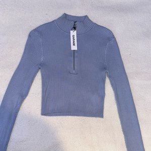 Light blue half zip sweater from garage. Size small.